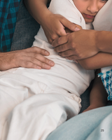 parents comforting their child